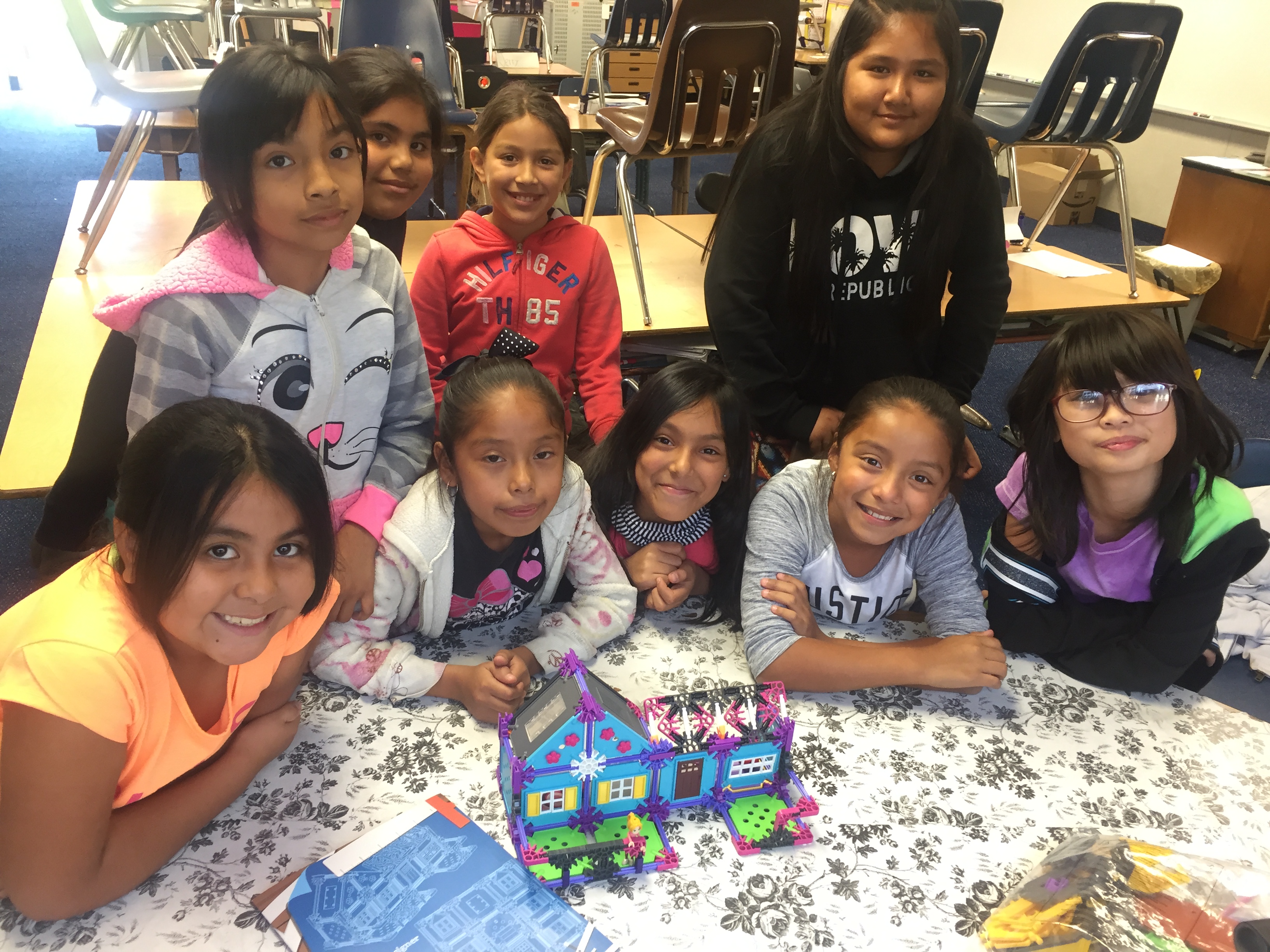 Students smile after completing their model house!