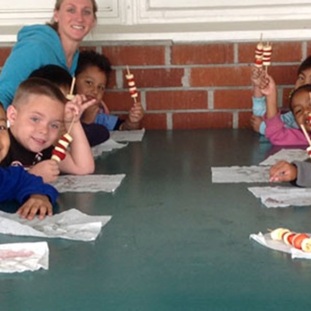 Students having a snack break during their activity.