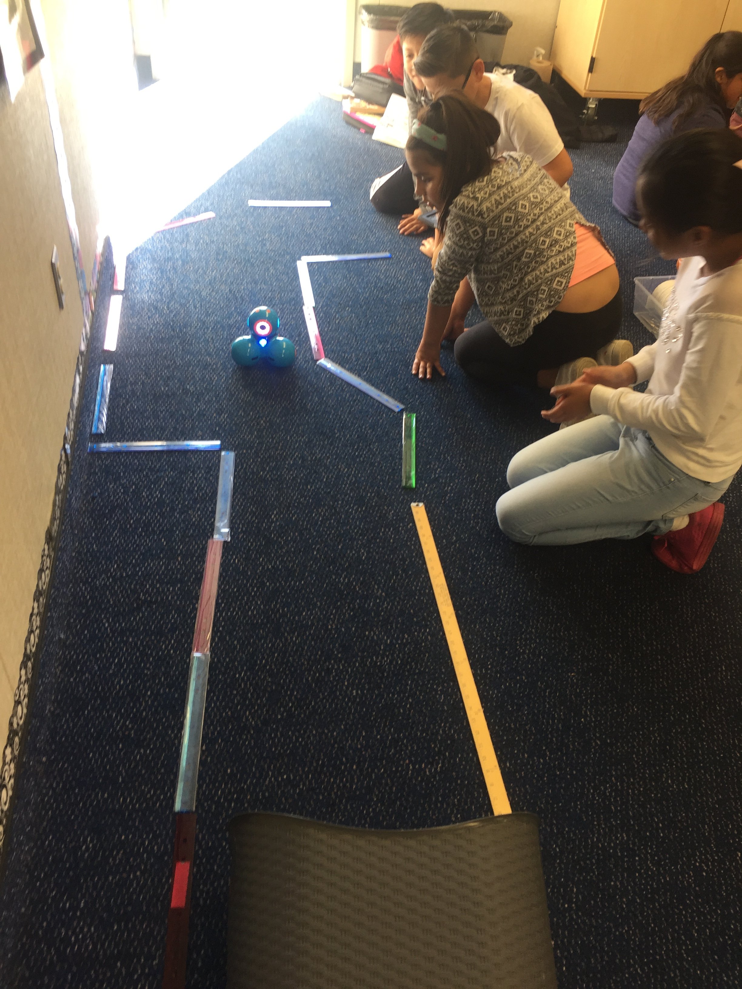 Our students master the precision that it takes to navigate the robots through a trail. 